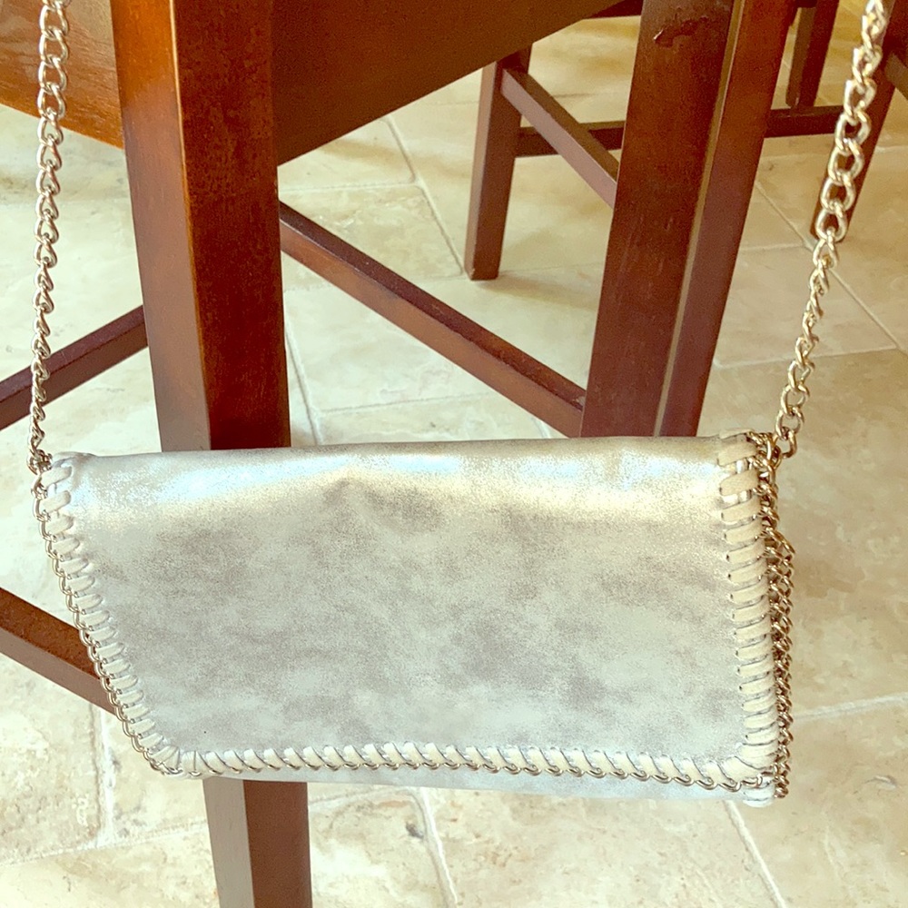 Silver color clutch and crossbody bag